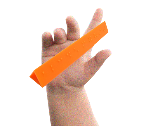 child's hand holding Braille Stick